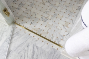 Zander's Interiors | Parade of Homes 2025 | Tile Flooring - Gold